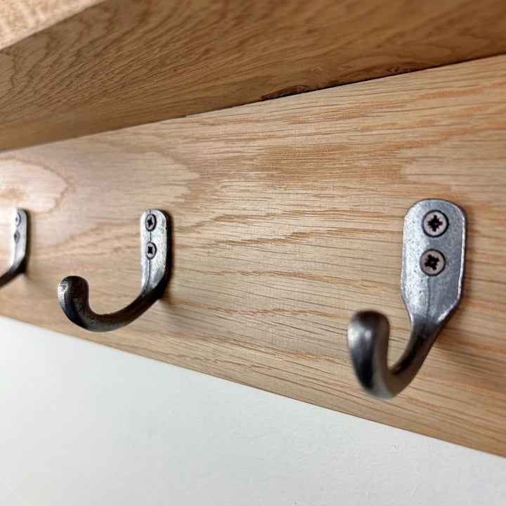 Oak coat rack with integrated shelf - polished cast iron single hooks